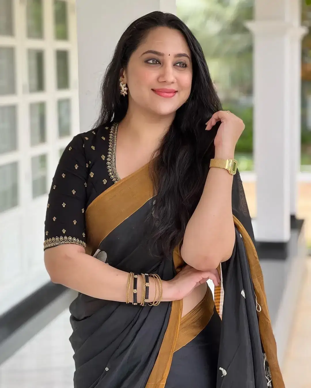 Beautiful Indian Queen Miya George in Traditional black Saree